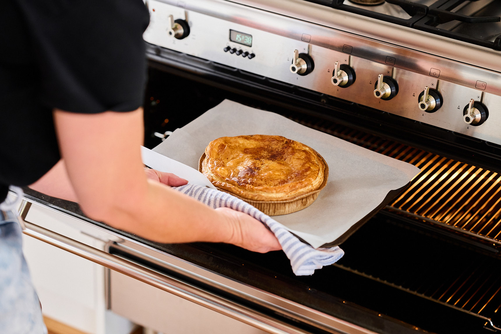 Bake at home pie being pulled from an oven